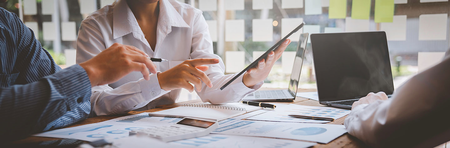 Custom-accounting-reports-people-at-a-table-discussing-reports2 Custom accounting reports people at a table discussing reports